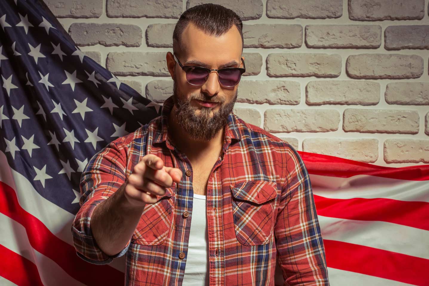 man with beard with american flag